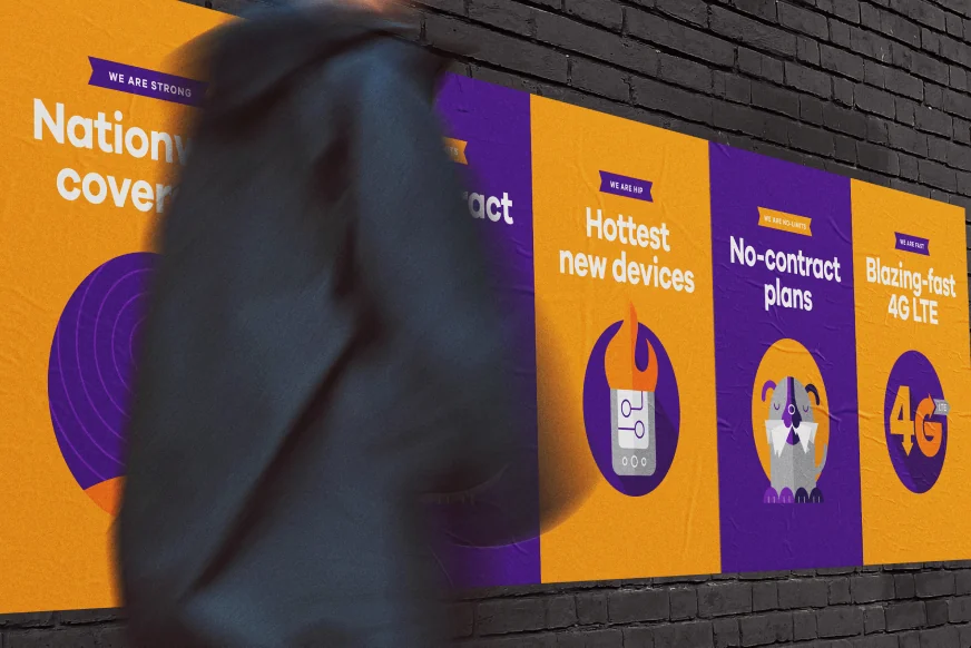 Out-of-home campaign posters on a wall